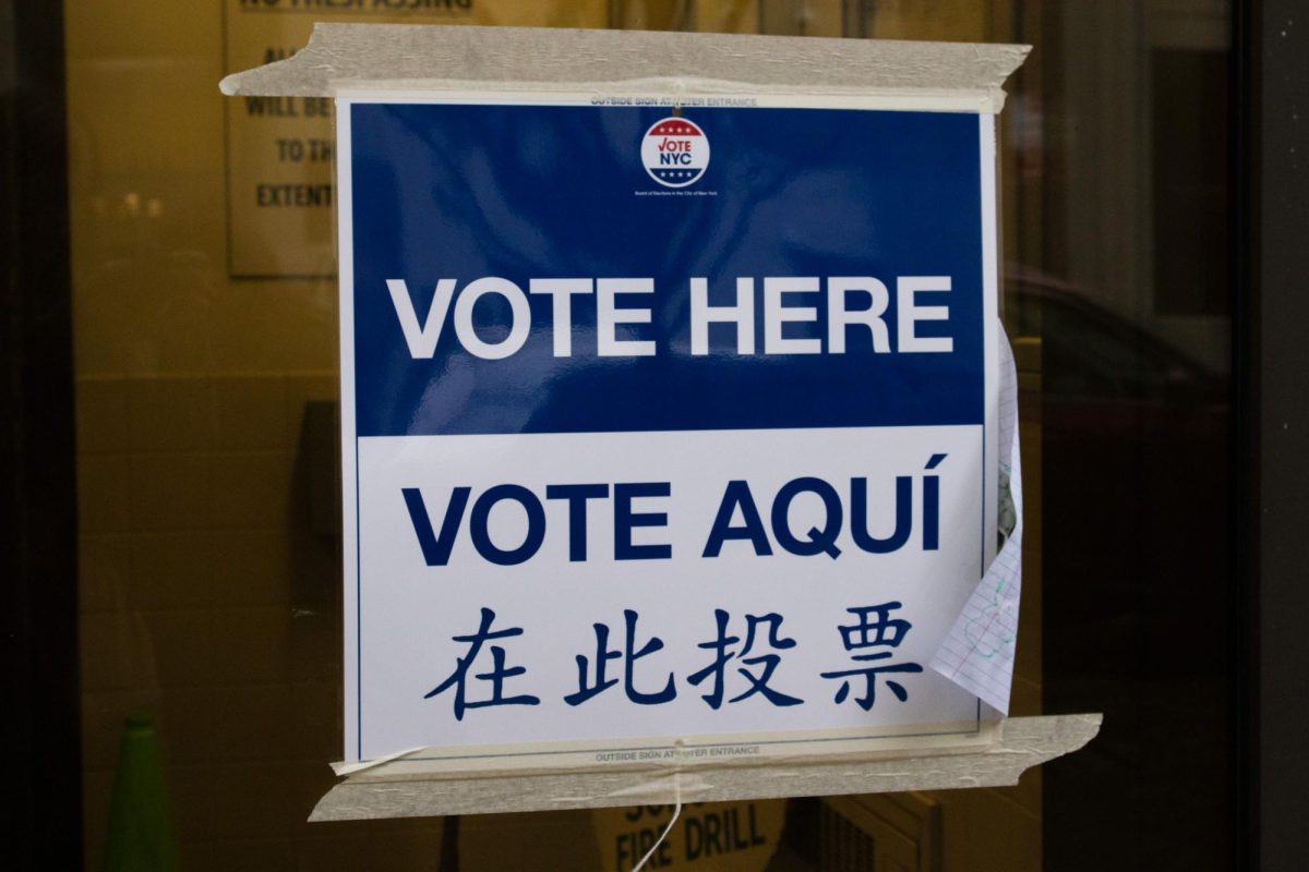 Vote here sign located outside of Art and Design lobby 10/30/25

